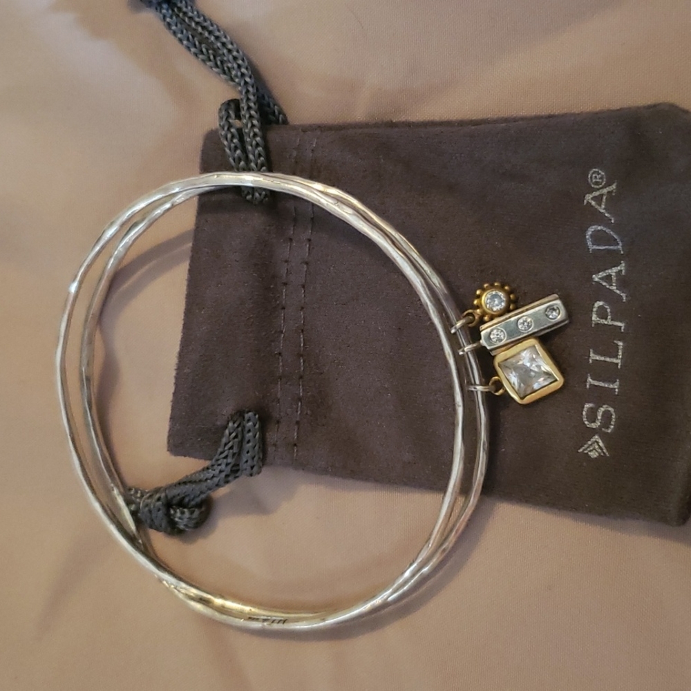Silpada Sterling Silver bracelet with 3 charms.